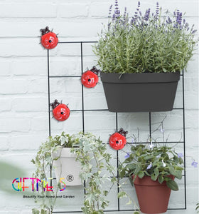 Durable metal construction resists fading and rust in outdoor spaces.
