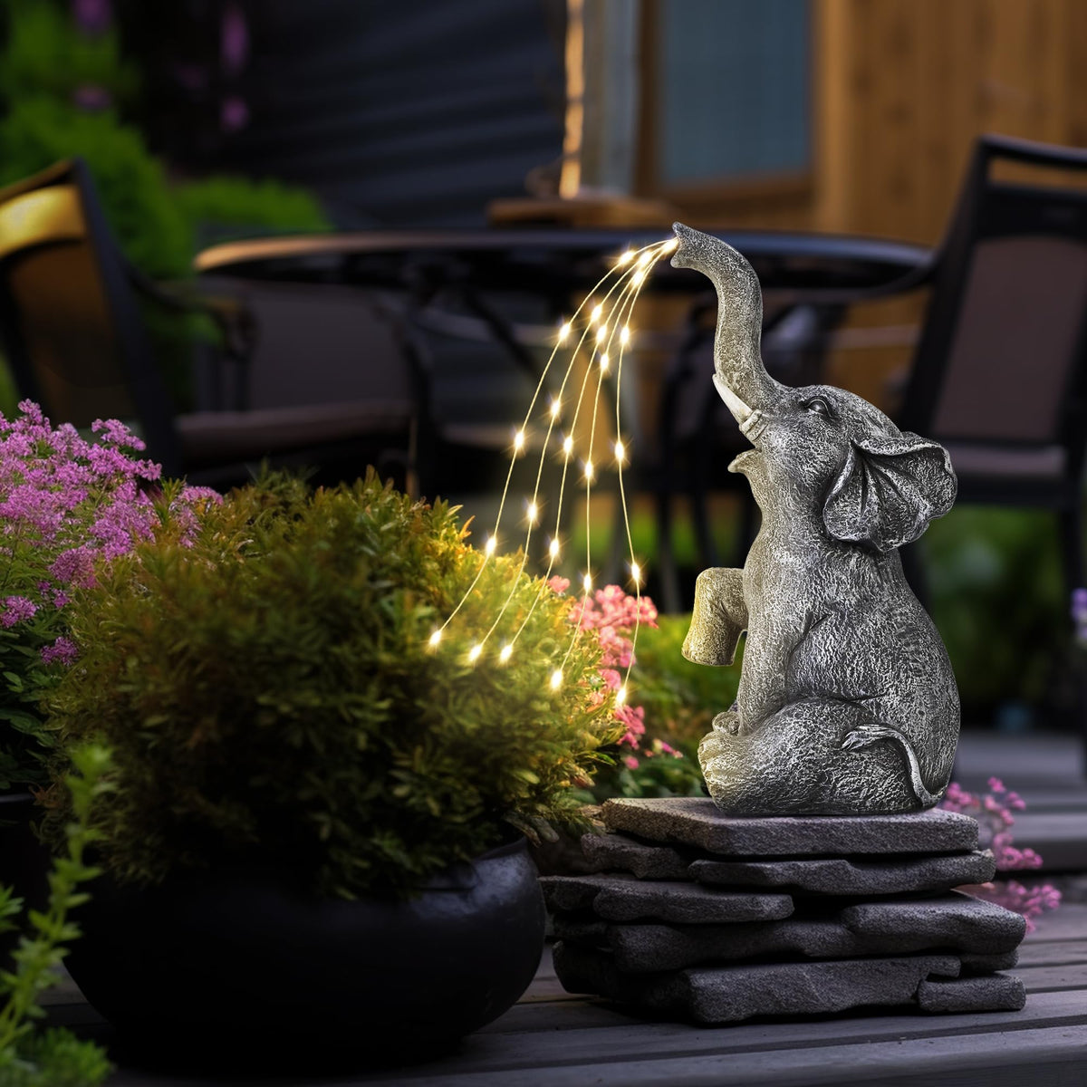 GIGALUMI birthday gift elephant sculpture, daytime display on steps or planters.