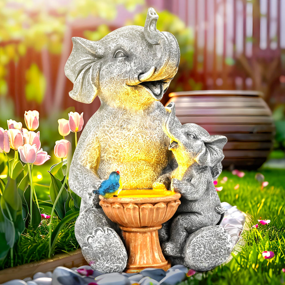 GIGALUMI solar elephant garden statue glows softly at dusk for welcoming outdoor ambiance.