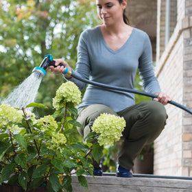 Gilmour Flexogen 25 ft hose coiled and ready for garden tasks