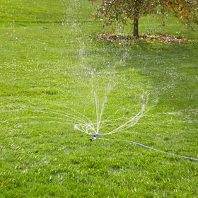 Gilmour metal-base spot sprinkler easily moves across garden beds