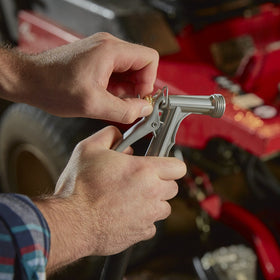 Gilmour hose nozzle handle closeup emphasizing comfortable grip and precise control.
