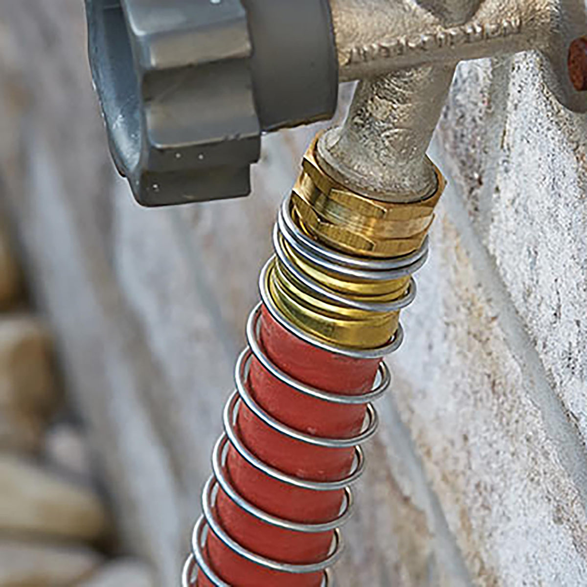 Gilmour Pro hose connected to a spigot with steady water flow
