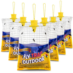 Glovv 6-pack fly traps installed outdoors near a barn for fly control.