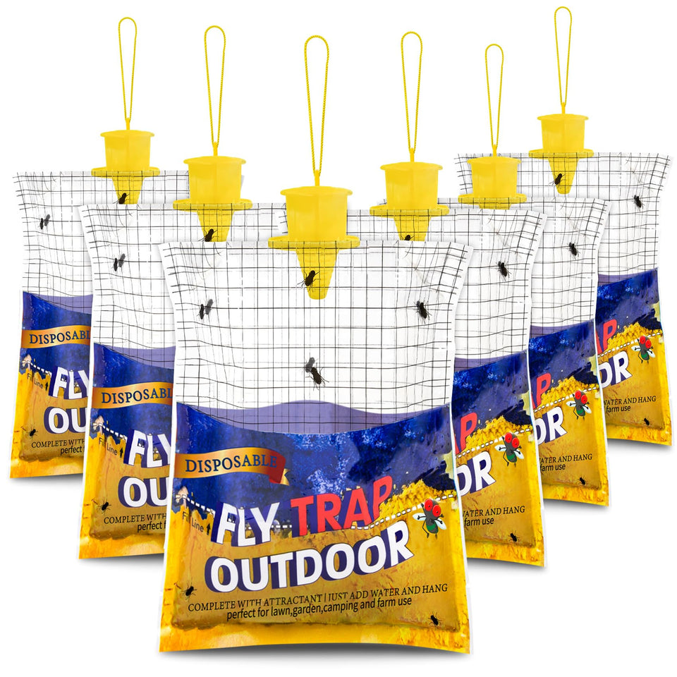 Glovv 6-pack fly traps installed outdoors near a barn for fly control.