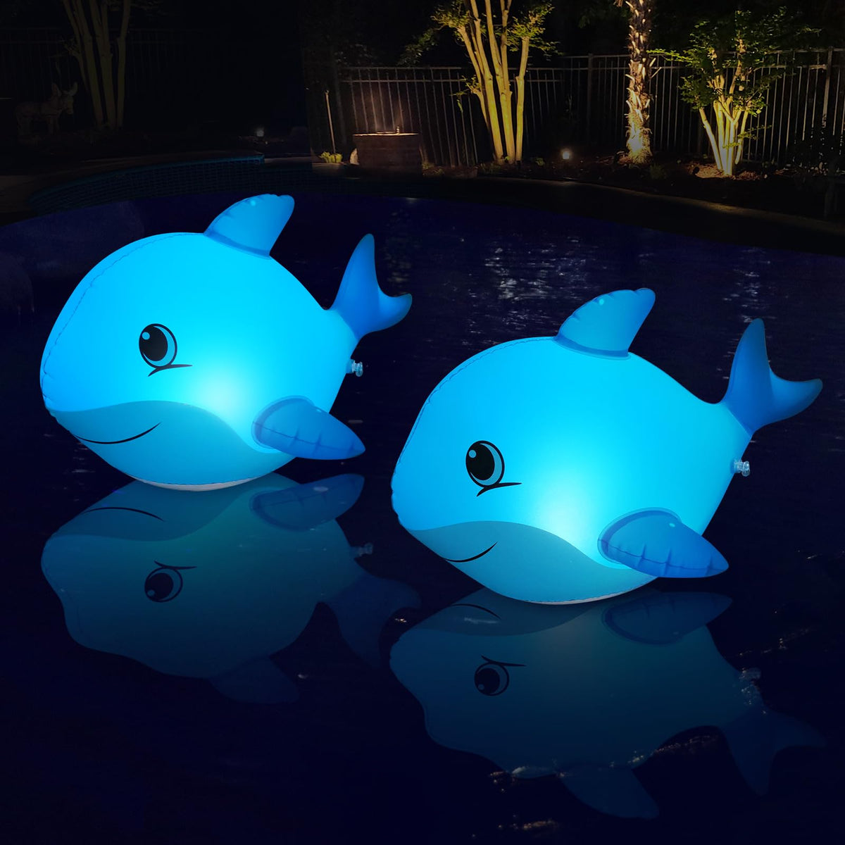 Goallim dolphin solar floating light glows softly on water for day-night pool ambiance.