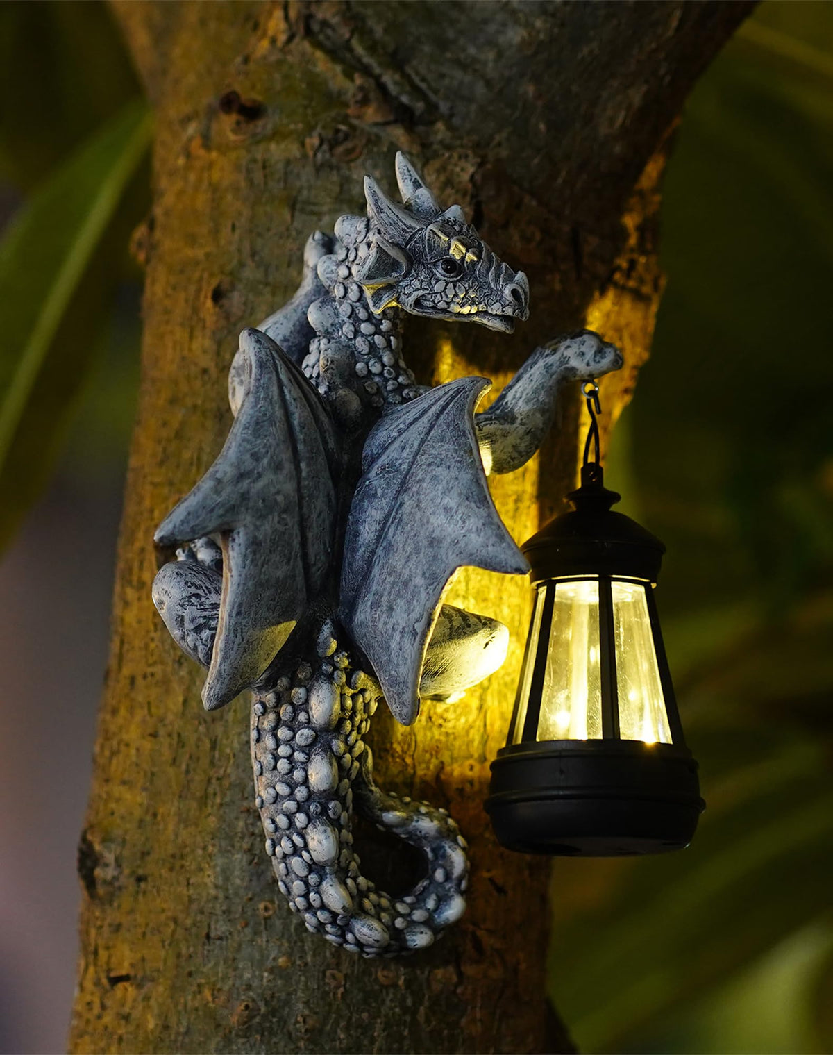 Goodeco Dragon Tree Hugger lantern glows softly to light outdoor evenings.