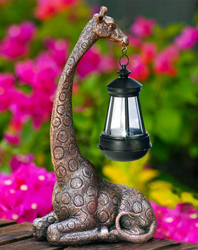 Goodeco giraffe statue garden ornament adds whimsy to outdoor spaces.