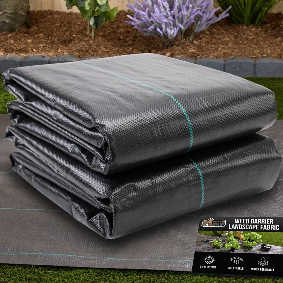 GORILLA GRIP weed barrier fabric rolled over soil in a garden bed for weed control.