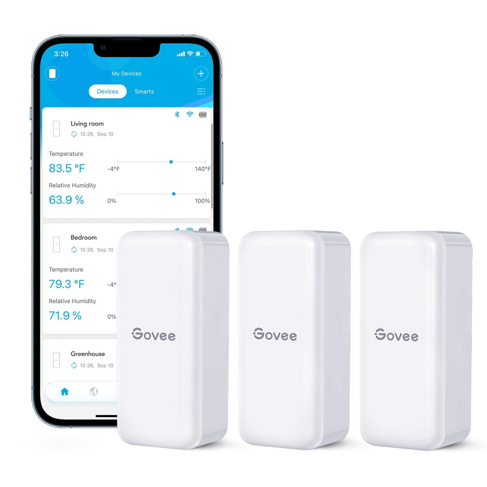 Govee H5100 sensor in hand for portable temperature monitoring in small spaces.