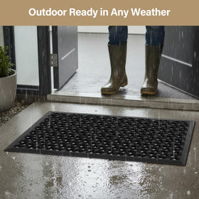 GRANNY SAYS black door mat offers timeless style for busy entrances.