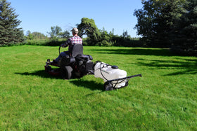 Grass Guardian 10-inch pneumatic tires conquering rugged turf.