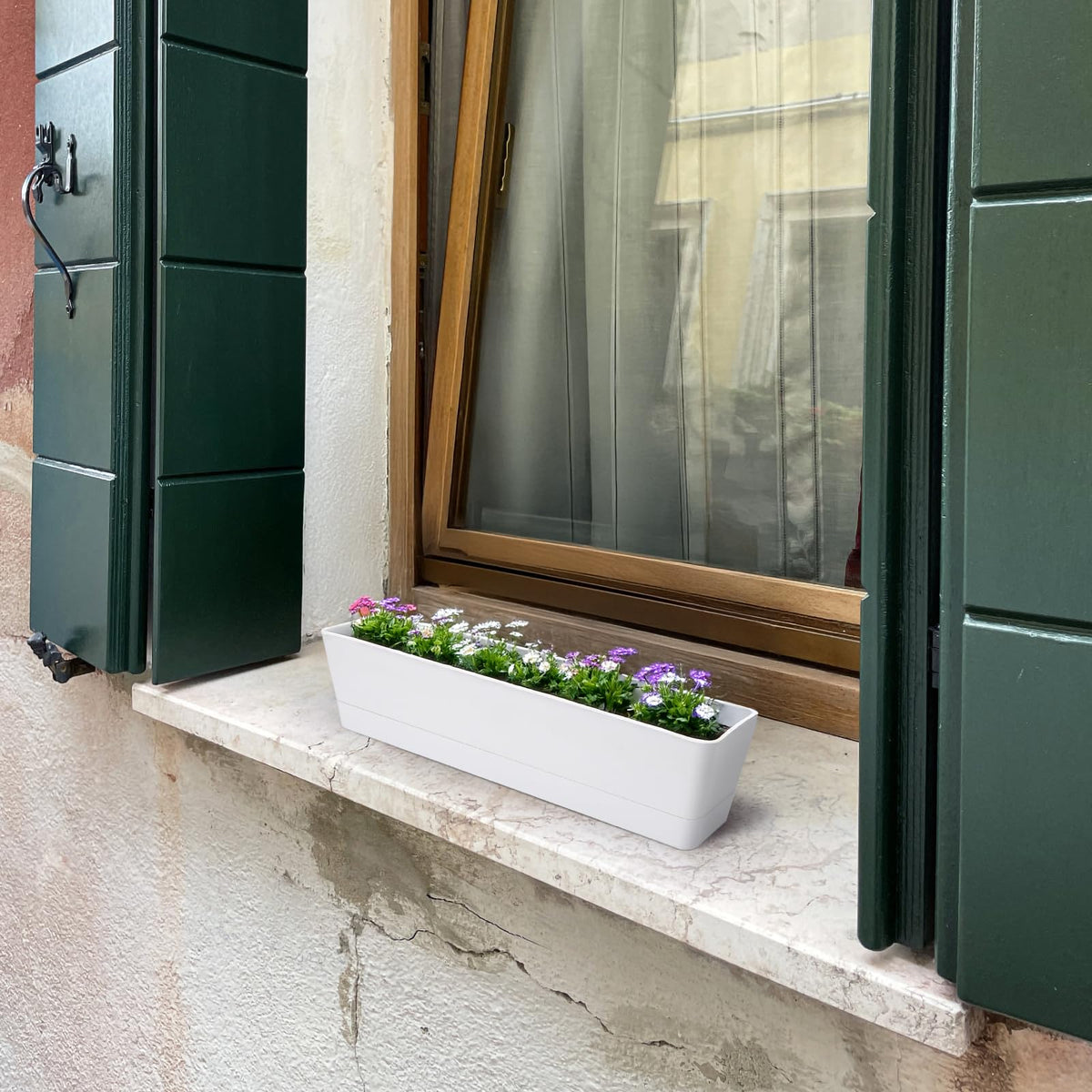 Lightweight, durable GREANER plastic planters easy to move indoors or outdoors