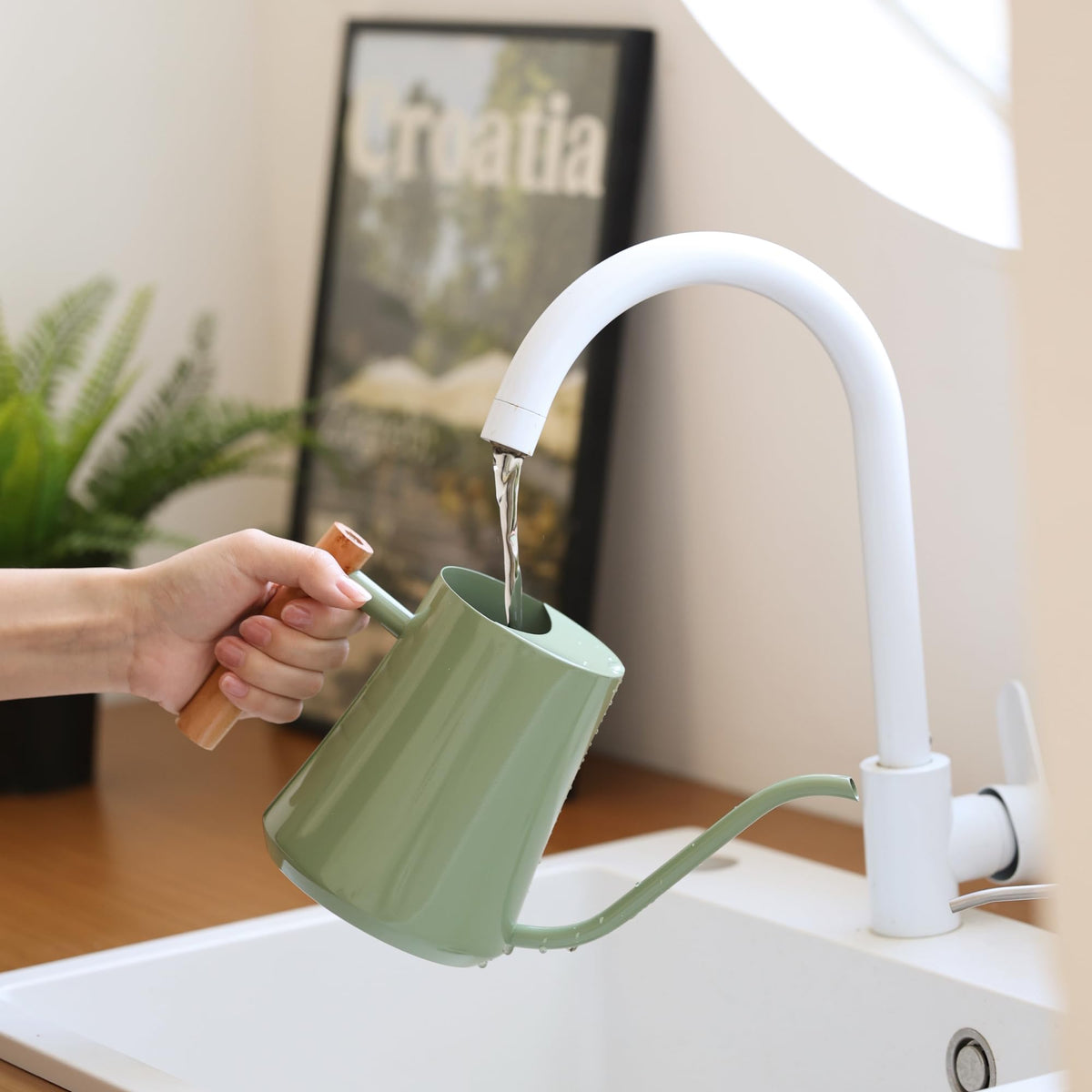Green Moon decorative indoor watering can doubles as a stylish plant accent
