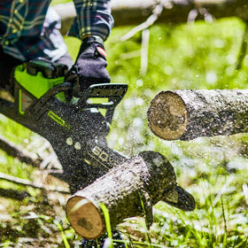 Greenworks Pro 60V chainsaw with battery included for immediate use.