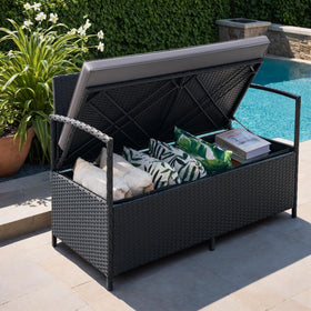 Greesum patio loveseat with red cushions adds color and comfort.
