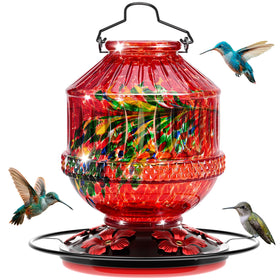 Grete Gotye blown-glass hummingbird feeder outdoors attracts hummingbirds