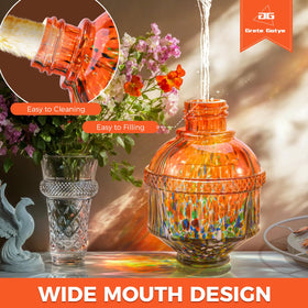 Grete Gotye hummingbird feeder orange on garden wall; perch supports hover-friendly feeding