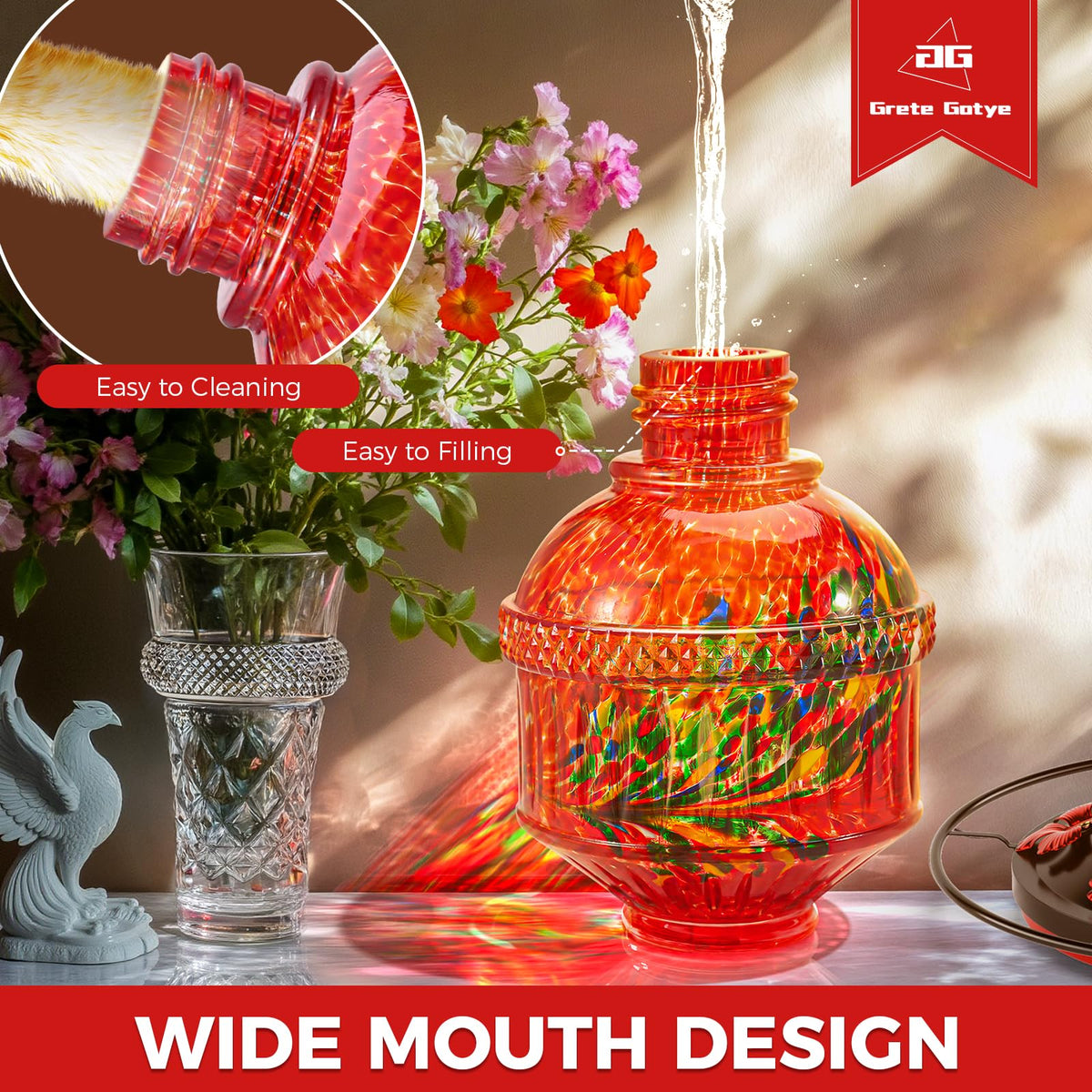 Grete Gotye phoenix-red glass feeder adds garden color