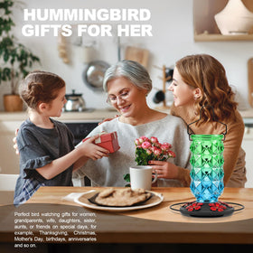 Grete Gotye outdoor decor enhances garden with a charming feeder