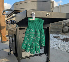 Grill Armor Gloves in action during a lively grill session.