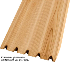 Grill Gourmet Cedar Hog in use with ergonomic handle for effective cleaning on grates