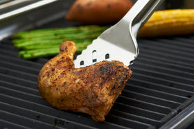 GrillPro 40240 stainless steel tong-turner demonstrating durability for outdoor grilling.