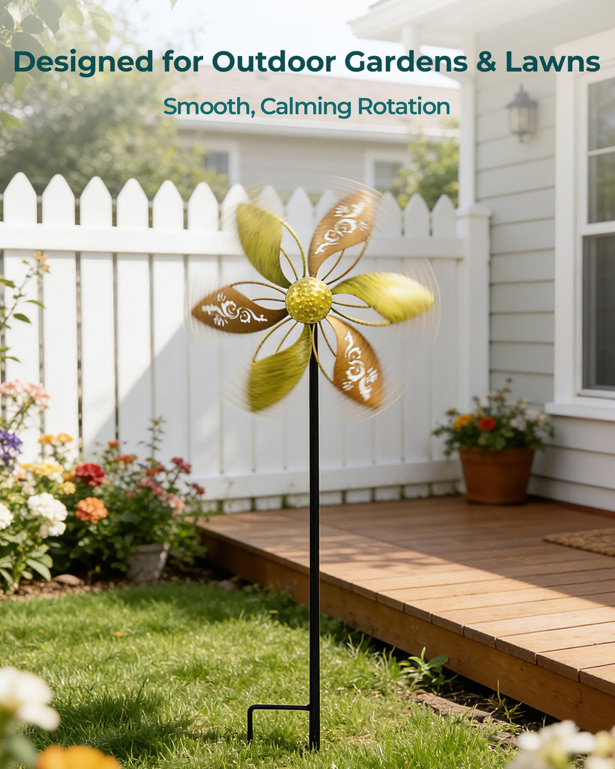 Gronhof gold ornate laser-cut floral spinner catching sunlight for decorative yard flair.