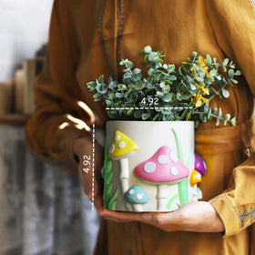 GUGUGO rainbow mushroom planter paired with small plants for chic desk decor