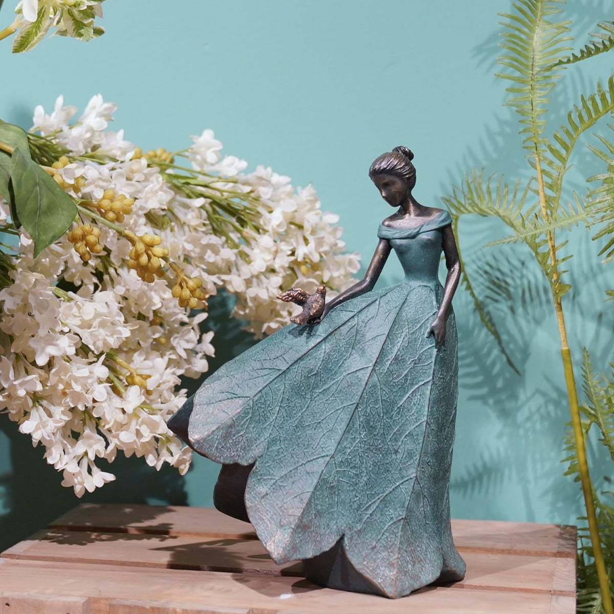 Guichifun leaf-skirt fairy figure in resin adds artful texture to indoor shelves.