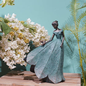 Guichifun leaf-skirt fairy figure in resin adds artful texture to indoor shelves.