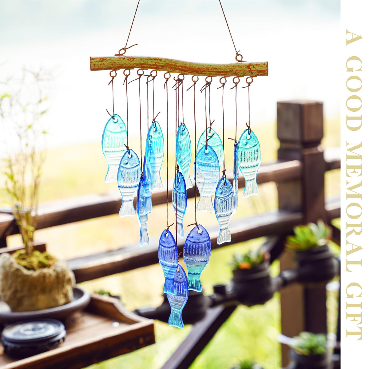 Blue glass fish wind chime by H&D Hyaline & Dora enhances garden decor with soothing tones.