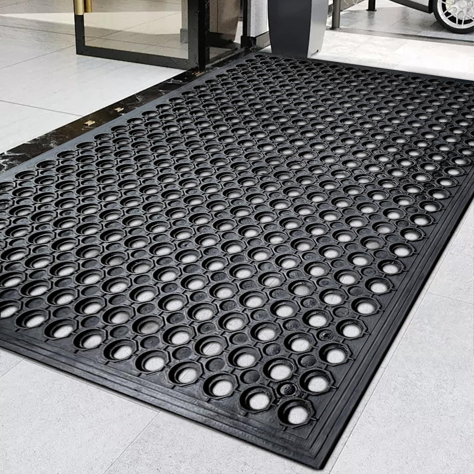 Halidec outdoor rubber floor mat with drainage holes for wet exterior areas.