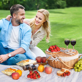 HappyPicnic wicker basket in meadow setting for relaxed outdoor meals