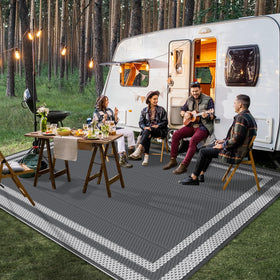 HappyTrends outdoor rug folded and ready to carry on camping trips.