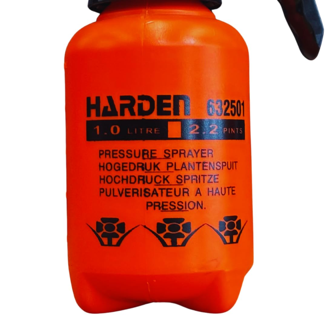Harden sprayer in action distributing mist on weeds and plants.