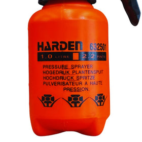 Harden sprayer in action distributing mist on weeds and plants.
