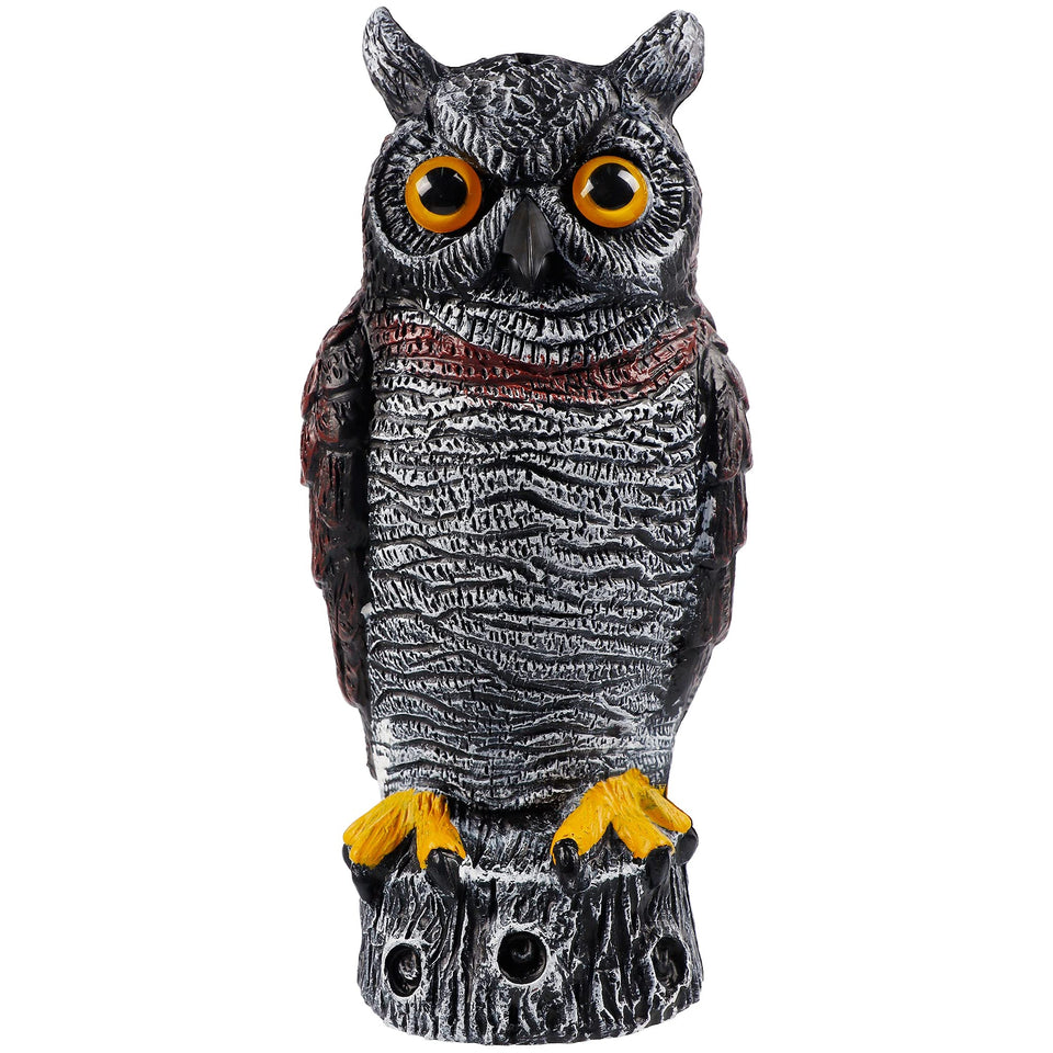 Hausse fake owl decoy perched in garden to deter birds and pests