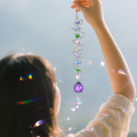 H D HYALINE & DORA crystal prism sun catcher brightening a window