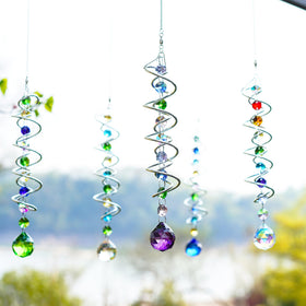 H D HYALINE & DORA gazing ball wind spinner in outdoor breeze