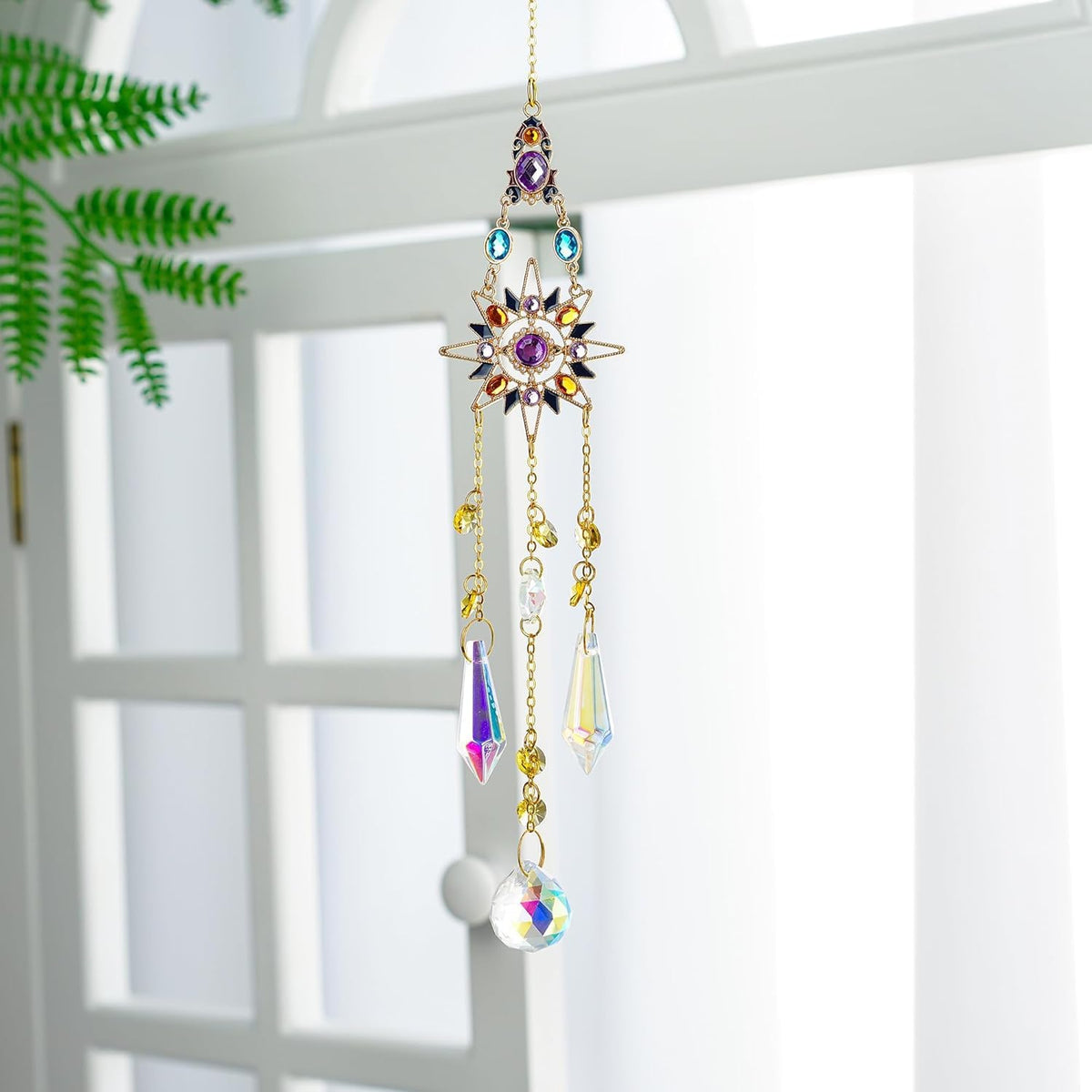 H&D HYALINE & DORA rainbow-maker prism pendant brightens indoor spaces.