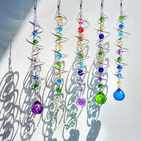 H D HYALINE & DORA sun catcher in the garden creating colorful light