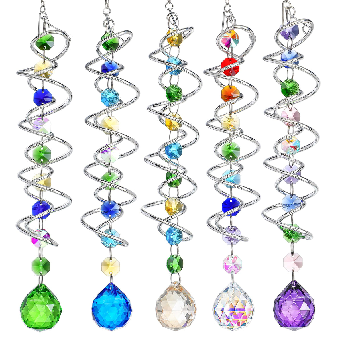 H D HYALINE & DORA sun catcher with spiral tail crystals reflecting sunlight in a window