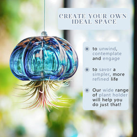 H&D Hyaline & Dora blue glass jellyfish decor in interior spaces with light.