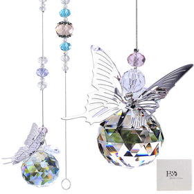 H&D HYALINE & DORA butterfly prism ball casts rainbow light from a window