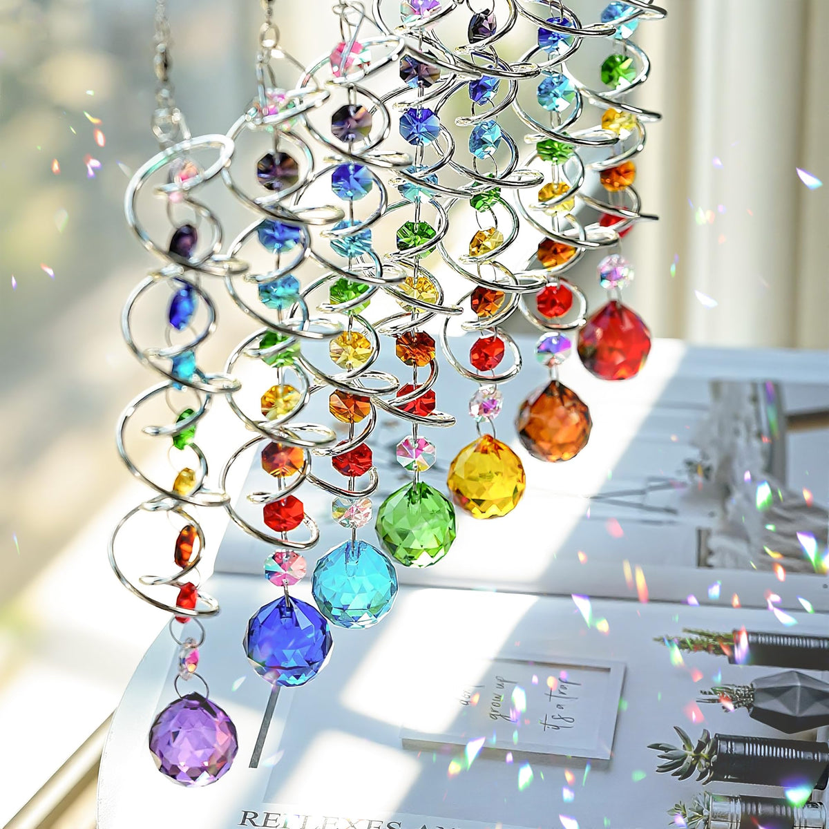H&D HYALINE & DORA colorful crystal balls reflecting rainbow hues