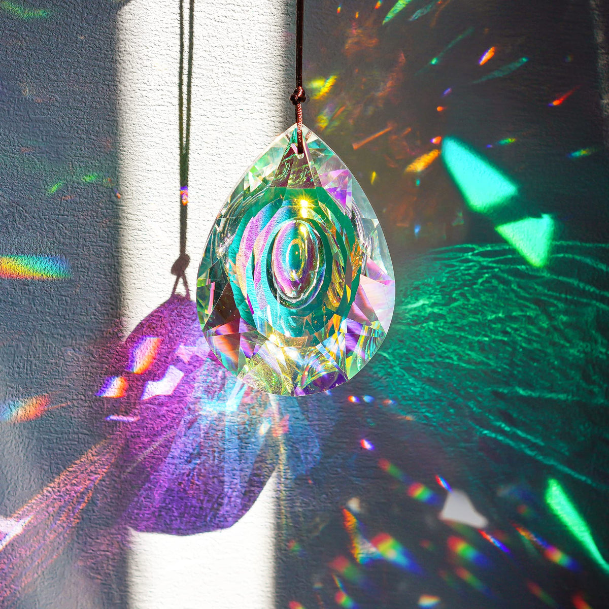 H&D HYALINE & DORA k9 crystal prism reflects bright rainbows.