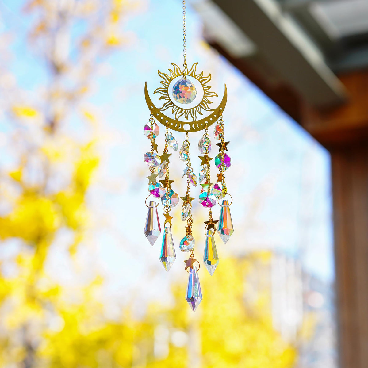 H&D HYALINE & DORA sun moon prism suncatcher casting prisms in a bright room