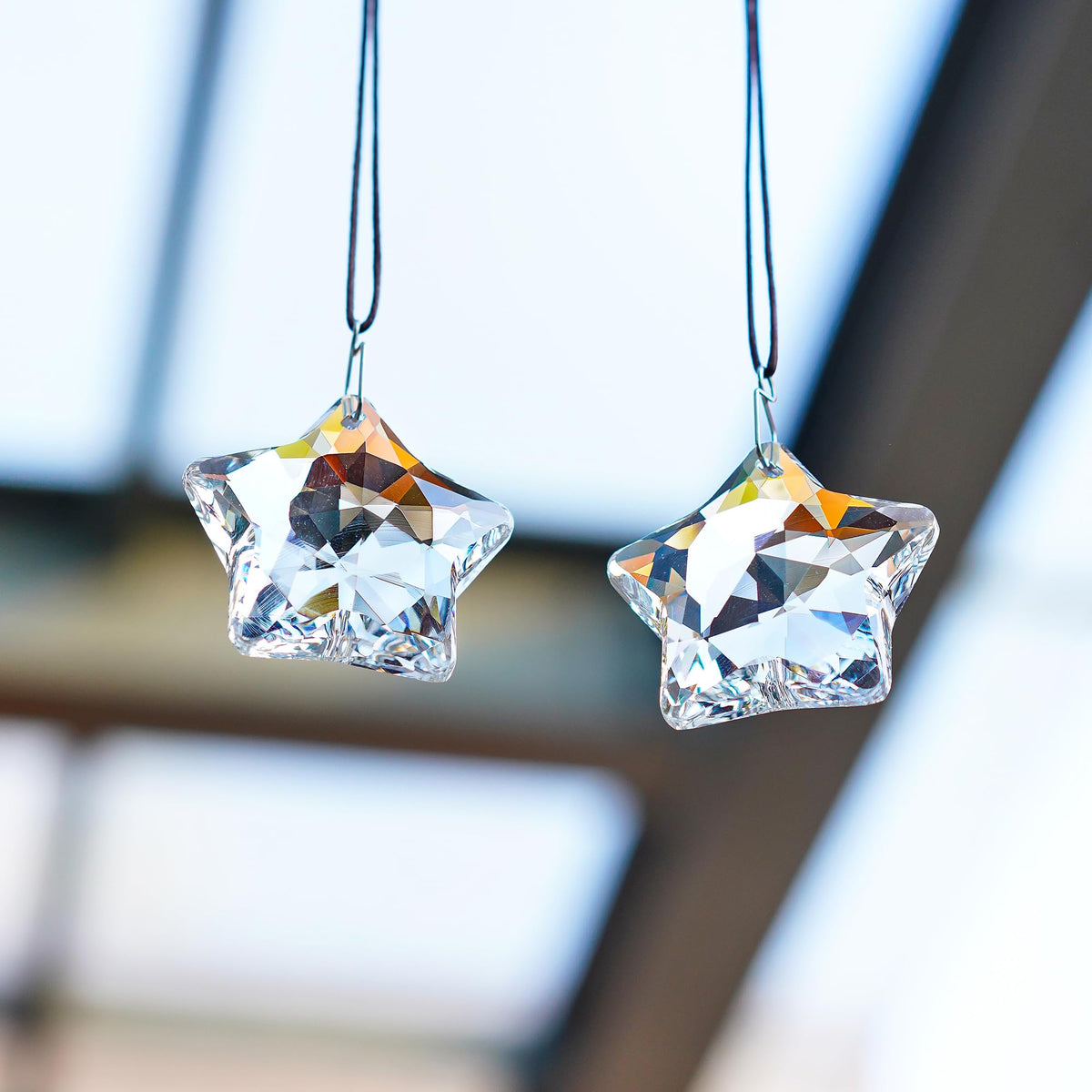 H&D HYALINE & DORA window decoration that catches sunlight.