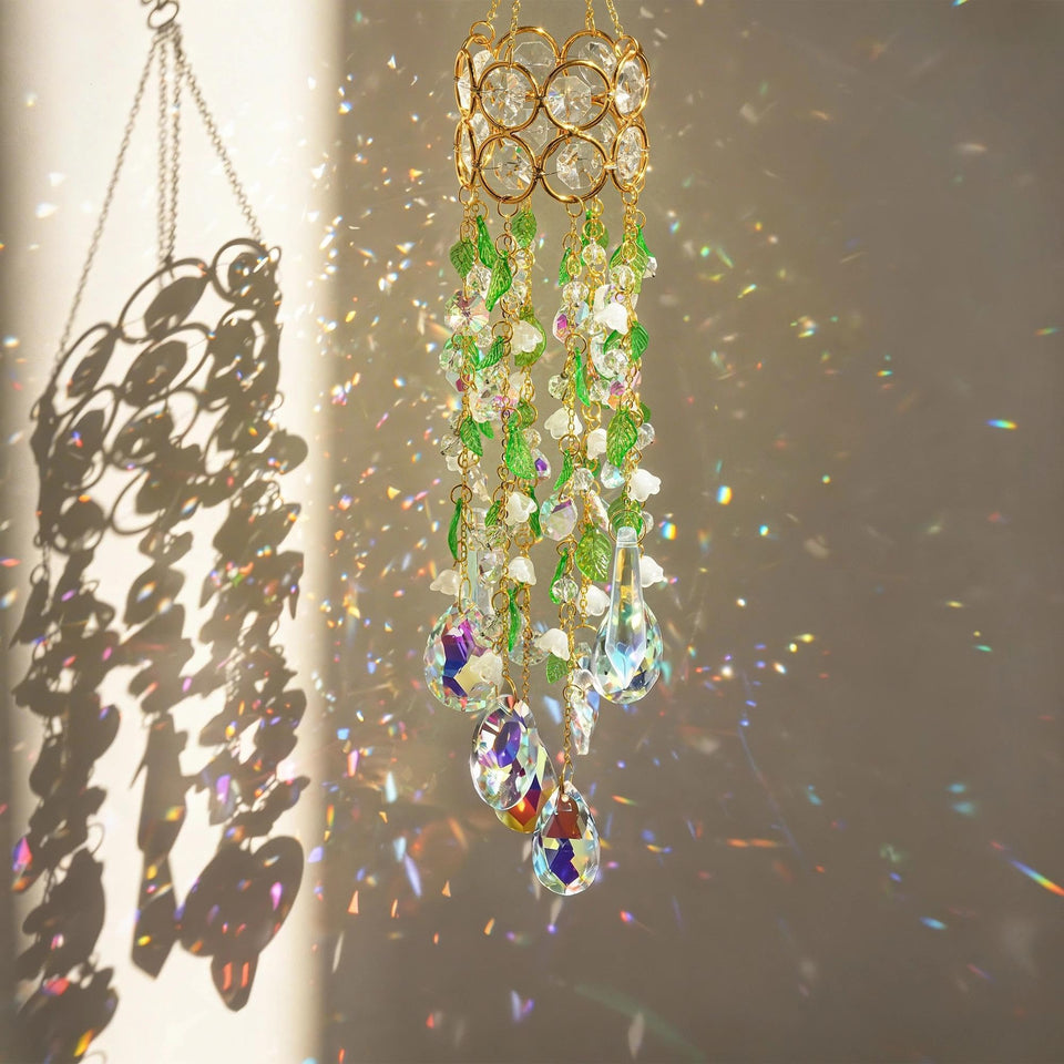 HDCRYSTALGIFTS crystal suncatcher with gold hoop casting rainbows on walls.